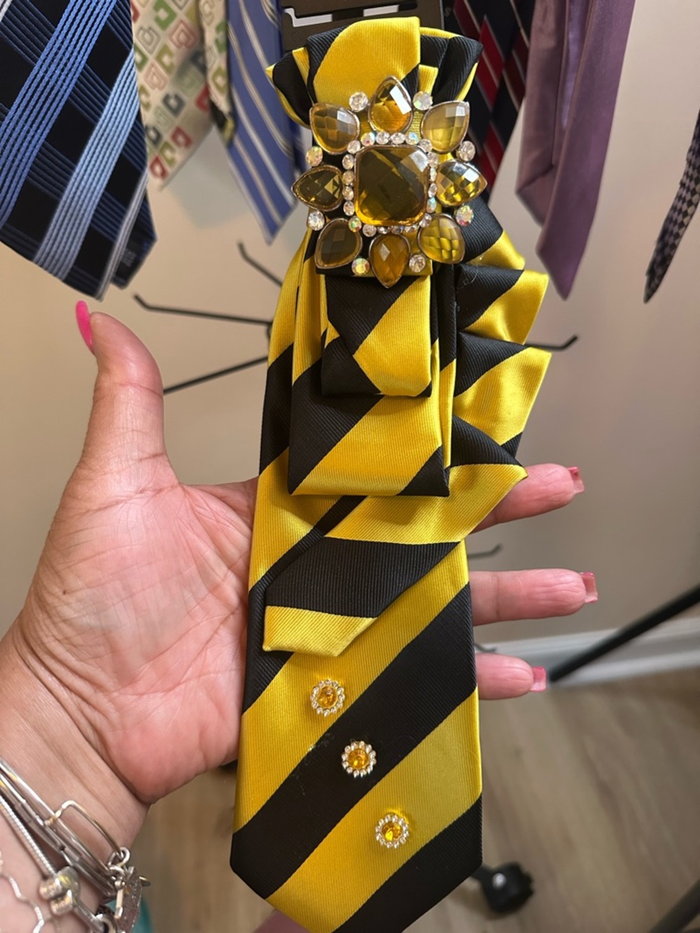 Yellow and Black Striped Tie with Jewel Brooch